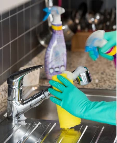 Two cleaners working through a home together